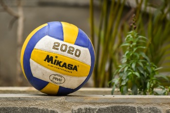 A Mikasa volleyball on the ground