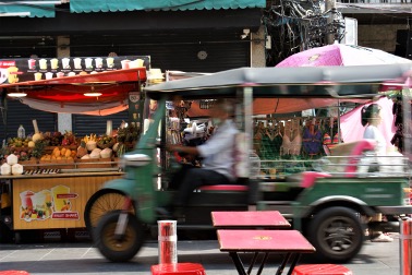 TukTuk races down the street in Thailand