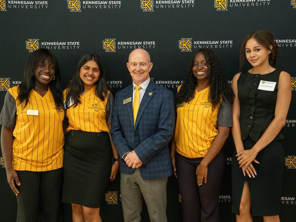  / Dr. Eric Arneson and four Kennesaw Excellence Society members. 