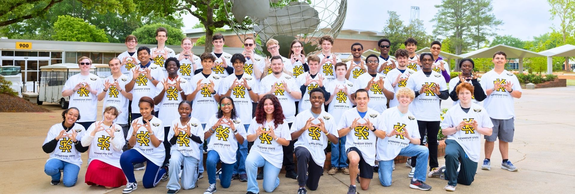 KSU flight 29 students in front of the globe in Marietta