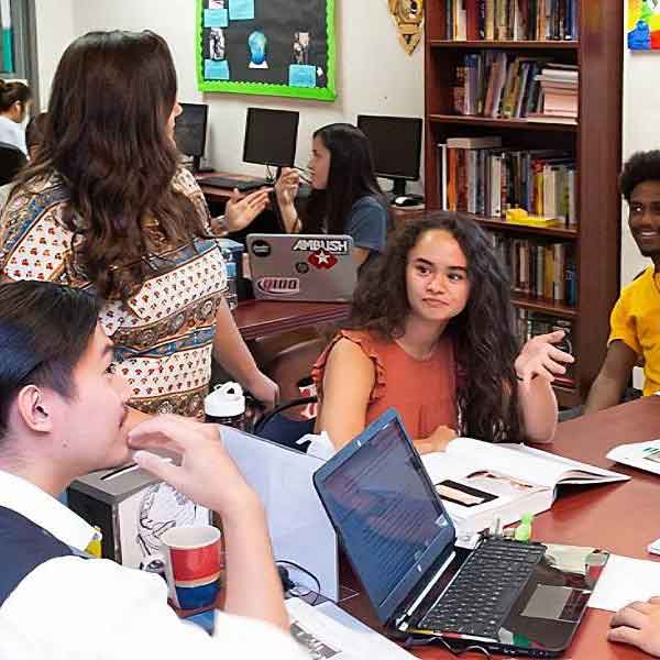 Group of KSU students taking a picture by the KSU sign.
