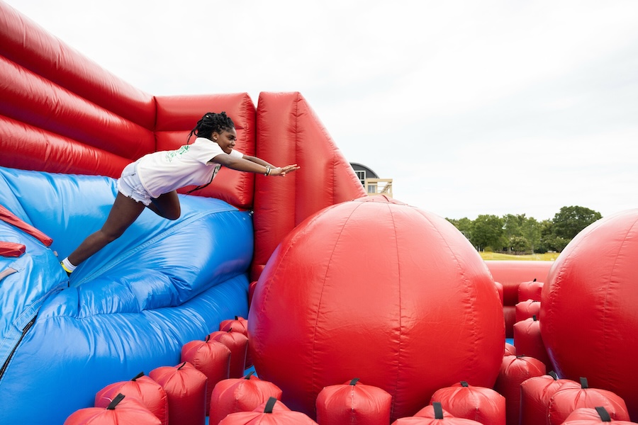 junior jum student leaping to inflatable ball