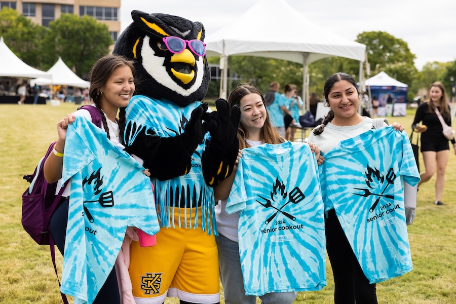 senior cookout students posing with scrappy with special tie-dye shirts