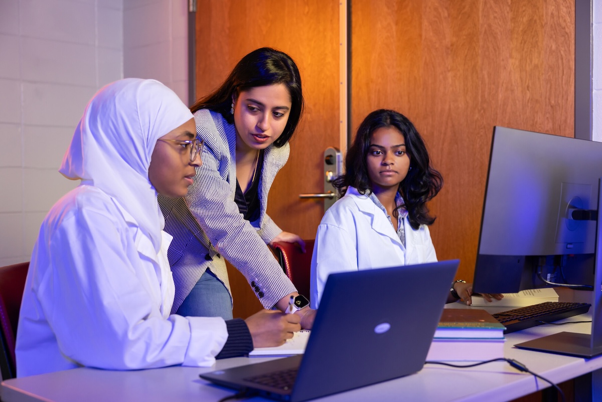 students looking at a laptop