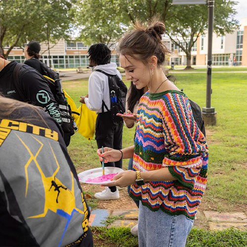 ksu students at the be true event stuffing teddy bears.