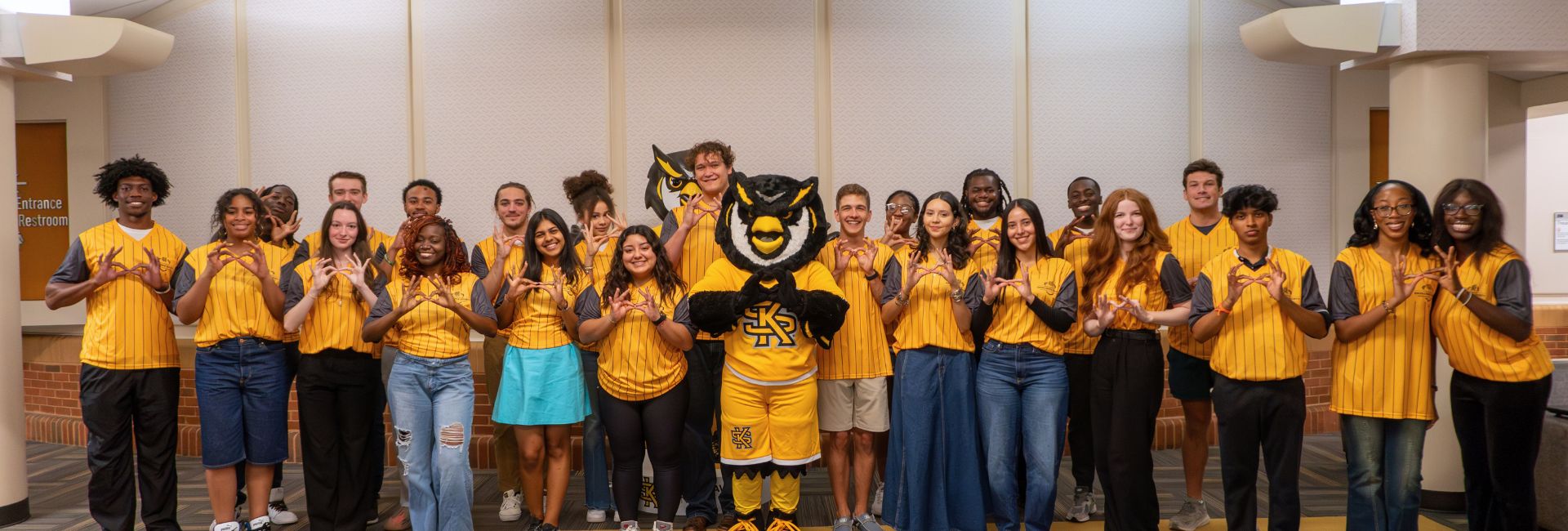 Kennesaw Excellence Society Students together with hooty hoo owl eyes