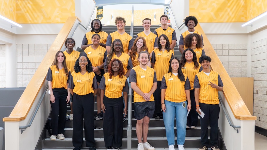 kennesaw excellence society students standing on the stairs