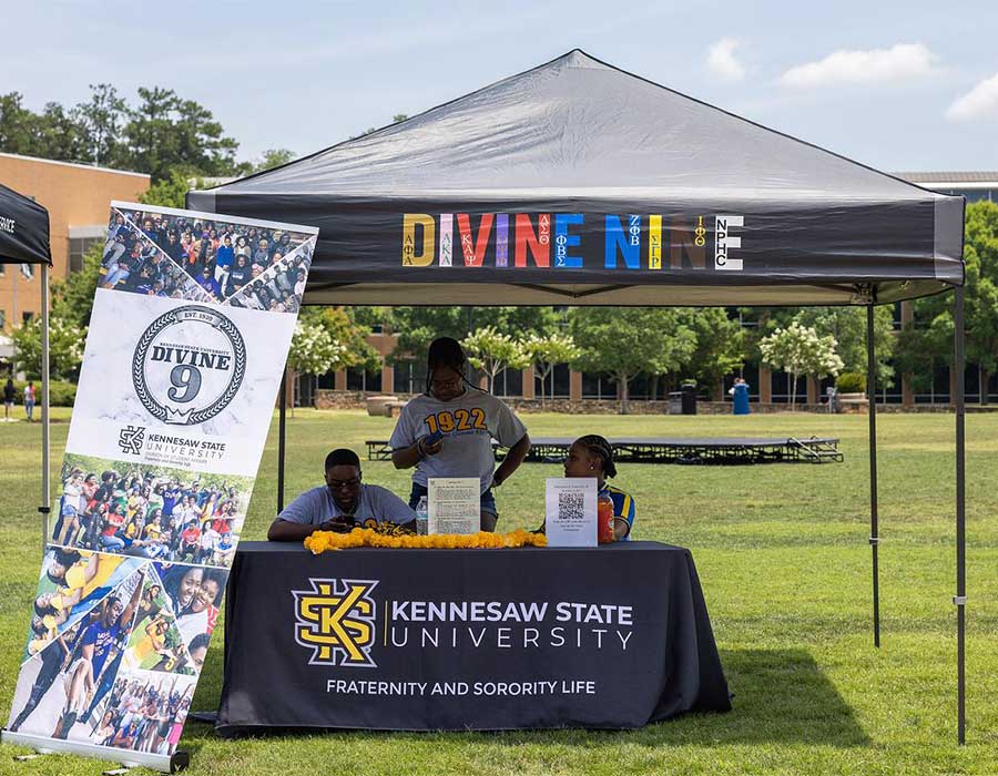 greek students under a tent