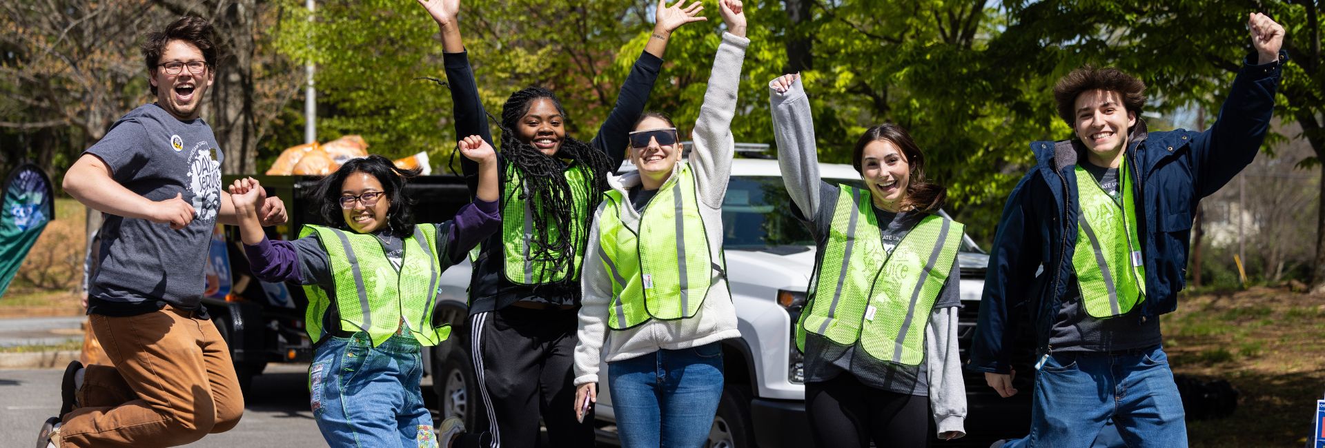 Student Voulenteers jumping in excitement