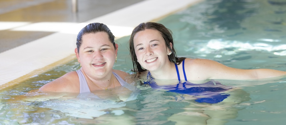 students swimming in a pool