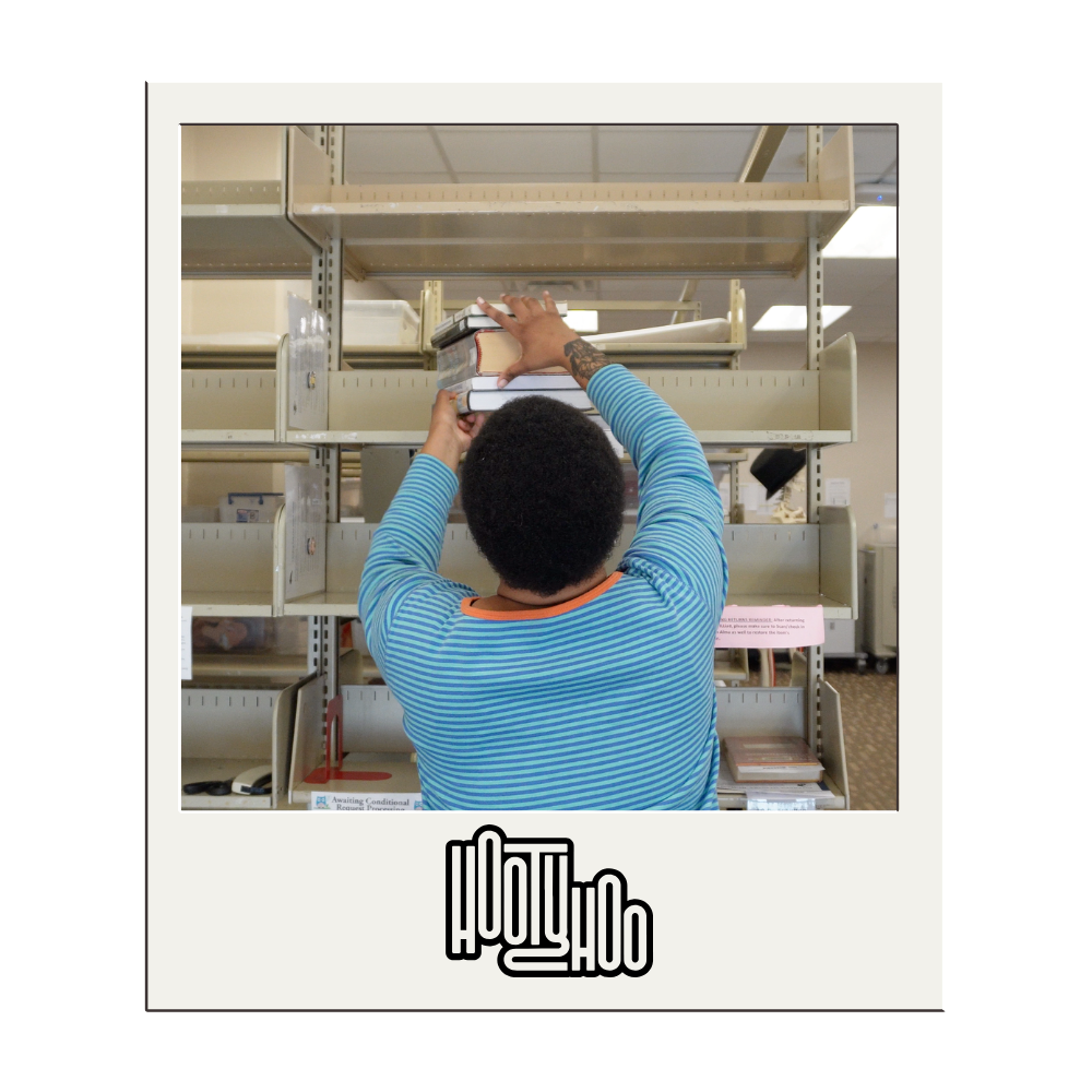 Varinah Dubuission organizing books. 