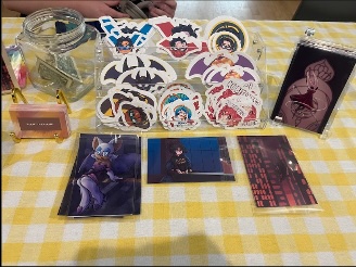 Stickers displayed at a booth at Owl Con.