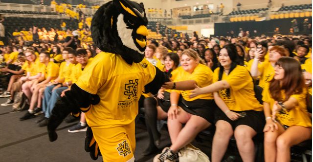 First-Year Convocation event with Scrappy giving high fives