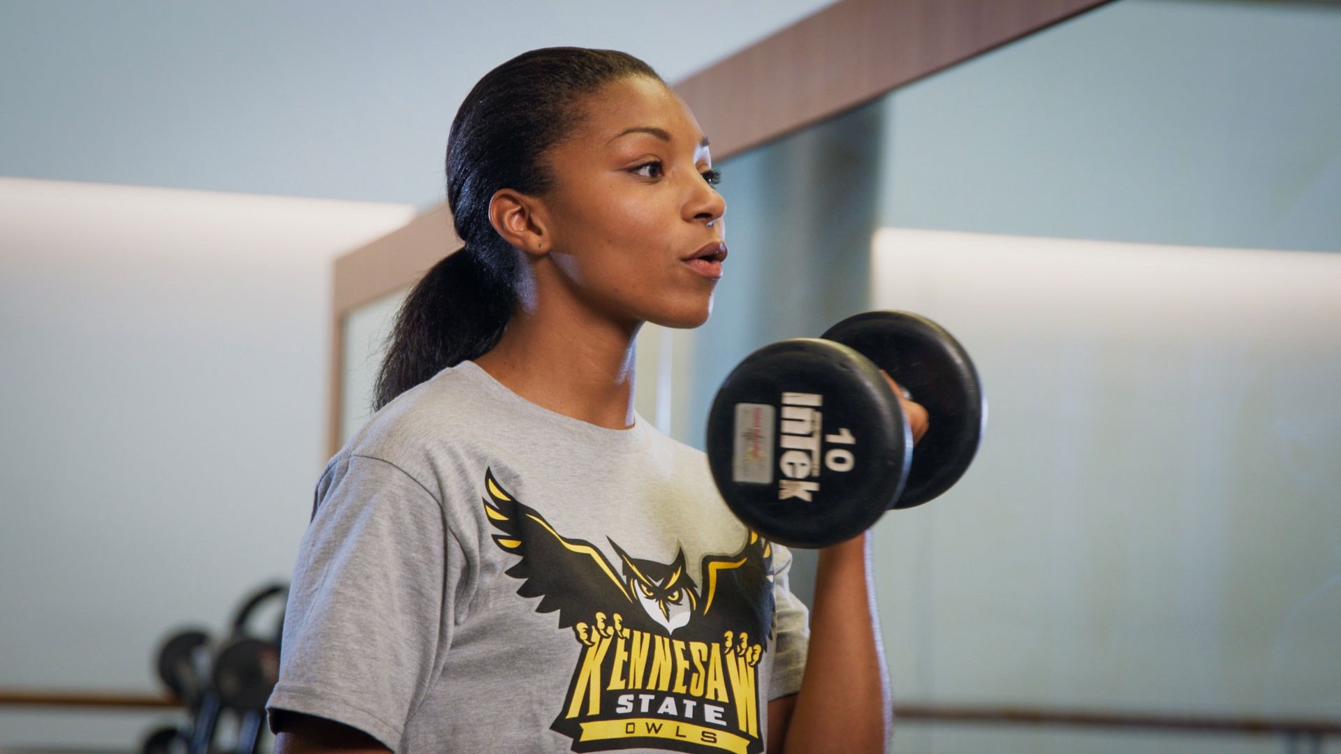 Student performing dumbell curl