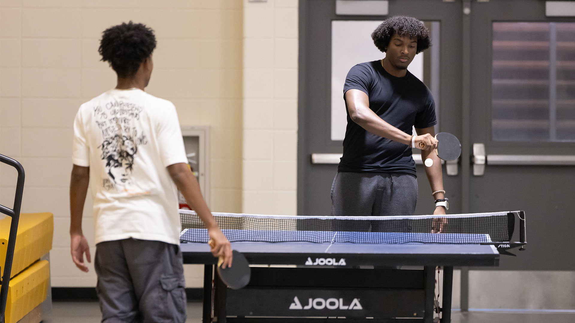 Students playing table tennis