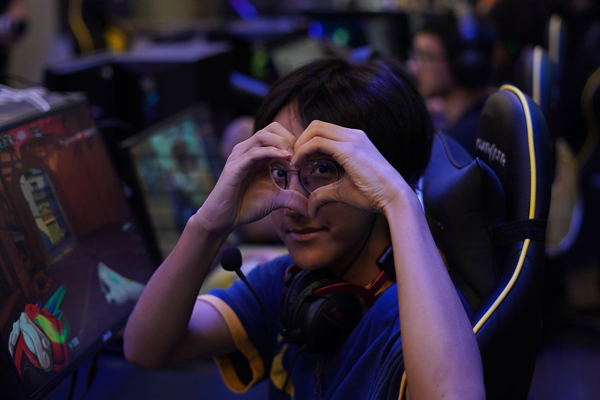 gamer making a heart shape with hands