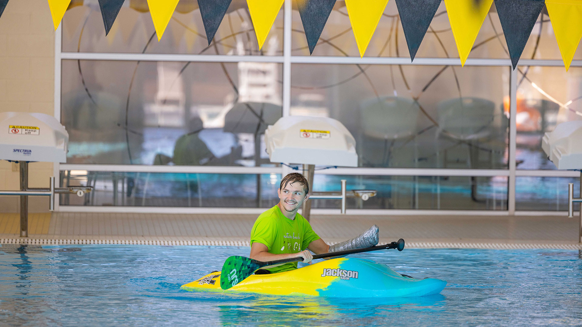 Student Kayaking in Pool
