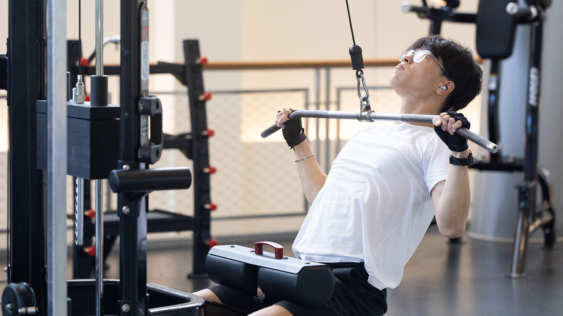 Student using weight machine