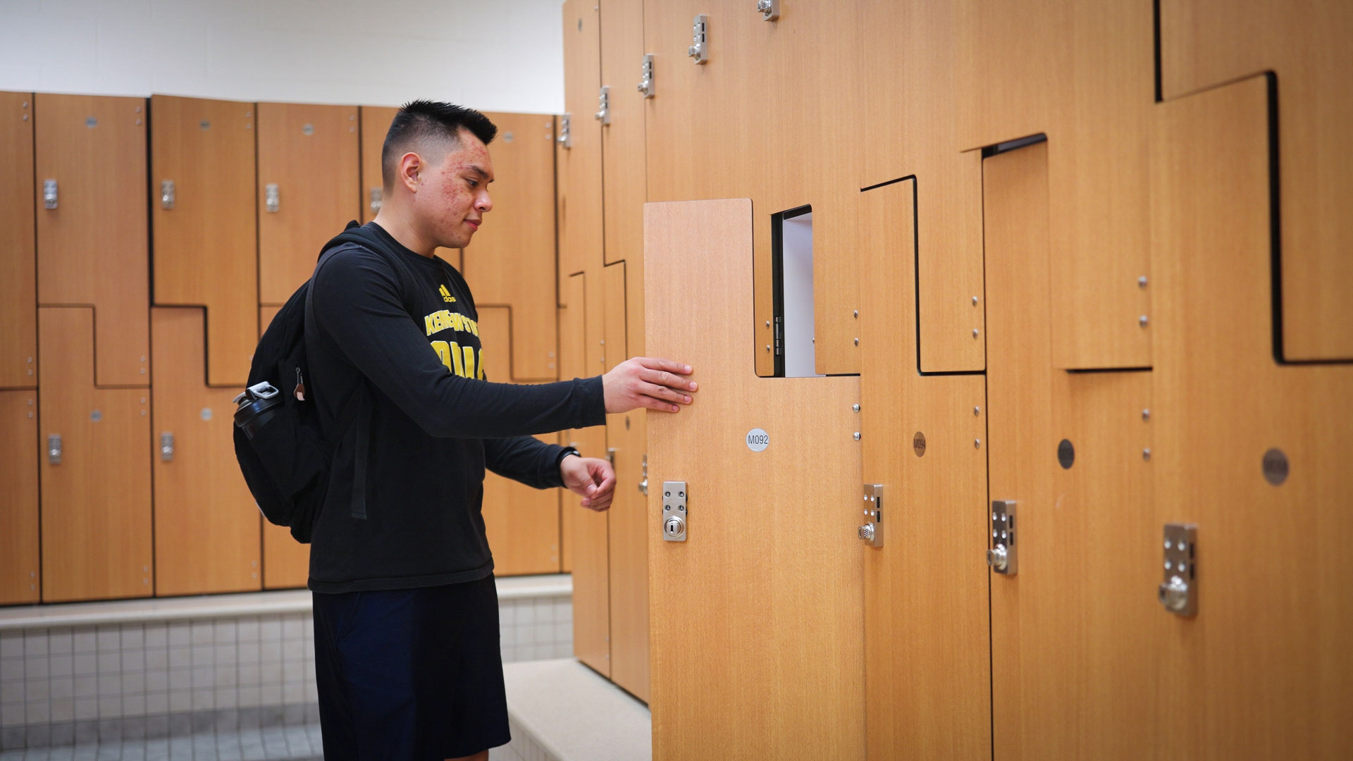 Student opening locker