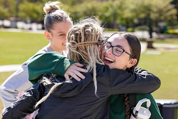 two students hugging