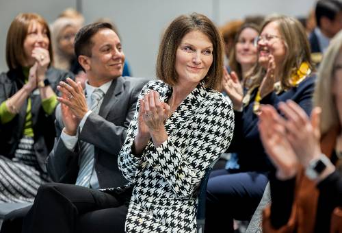KSU President Kat Schwaig and Provost Ivan Pulinkala smiling and clapping during the 2025 Celebration of Teaching 