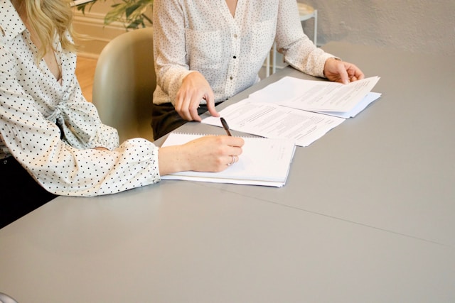 people looking at paper during consultation