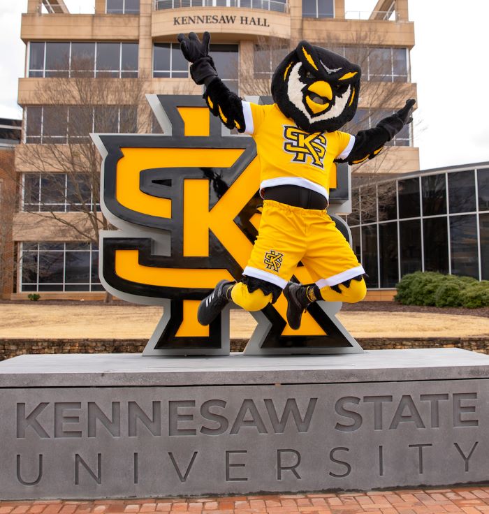 scrappy in front of kennesaw hall