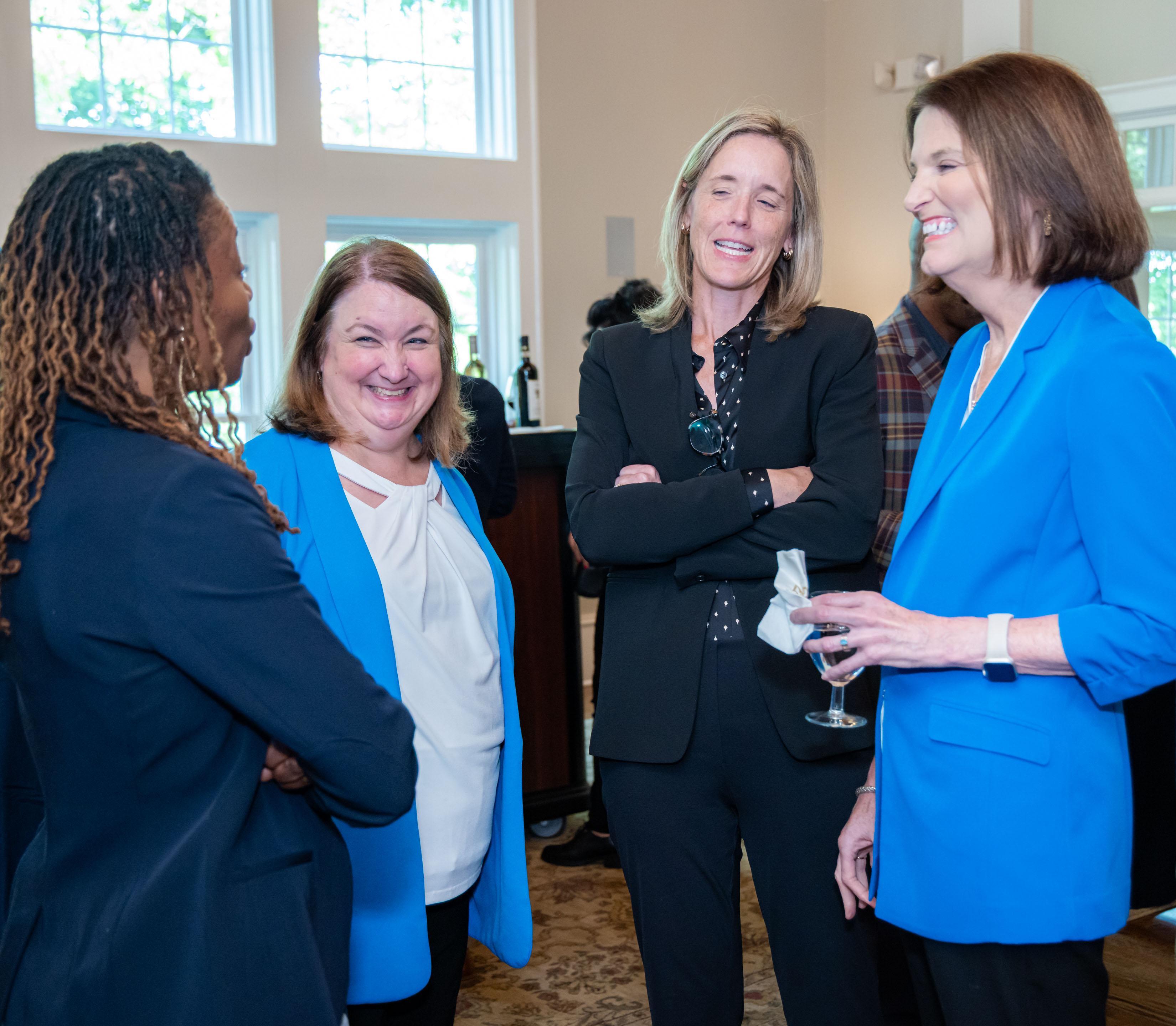  / president, kathy schwaig seated with guests 
