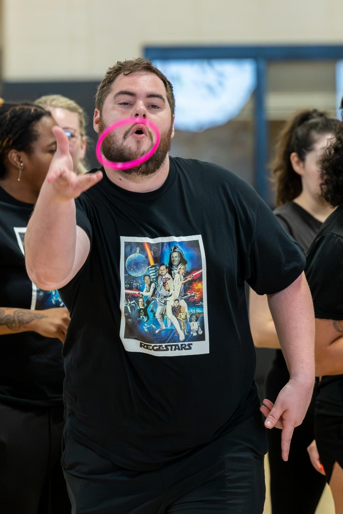 2026 Owlympics / Owlympics competitor tossing a pink ring during the games.