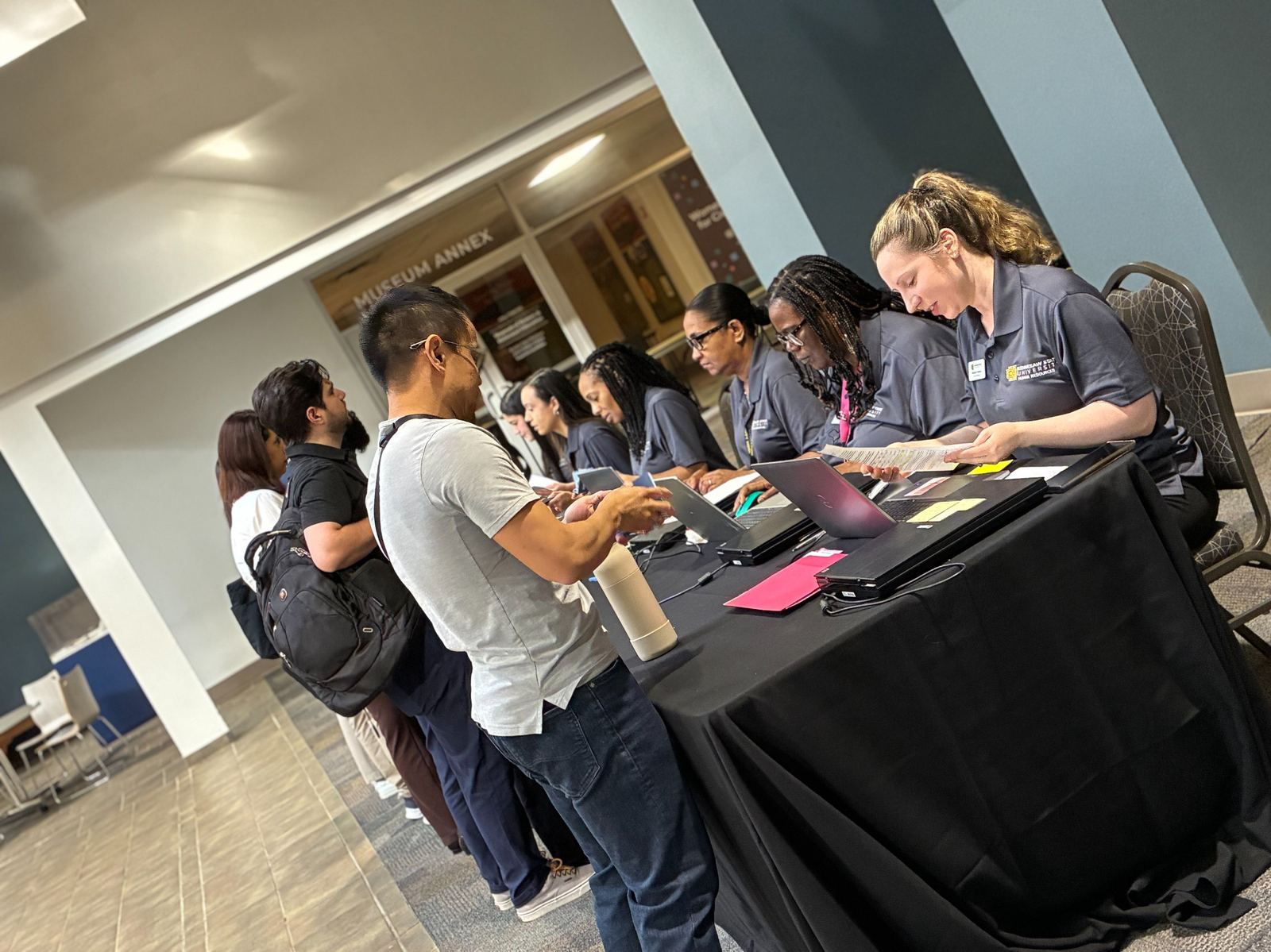 HR coordinators checking in new faculty at the 2026 Fall New Employee Orientation