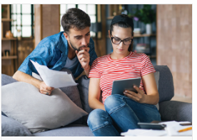 a couple looking at a tablet reviewing OE options