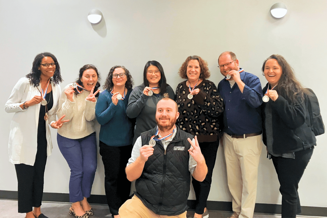 second place trivia winners smiling and showing off their medals
