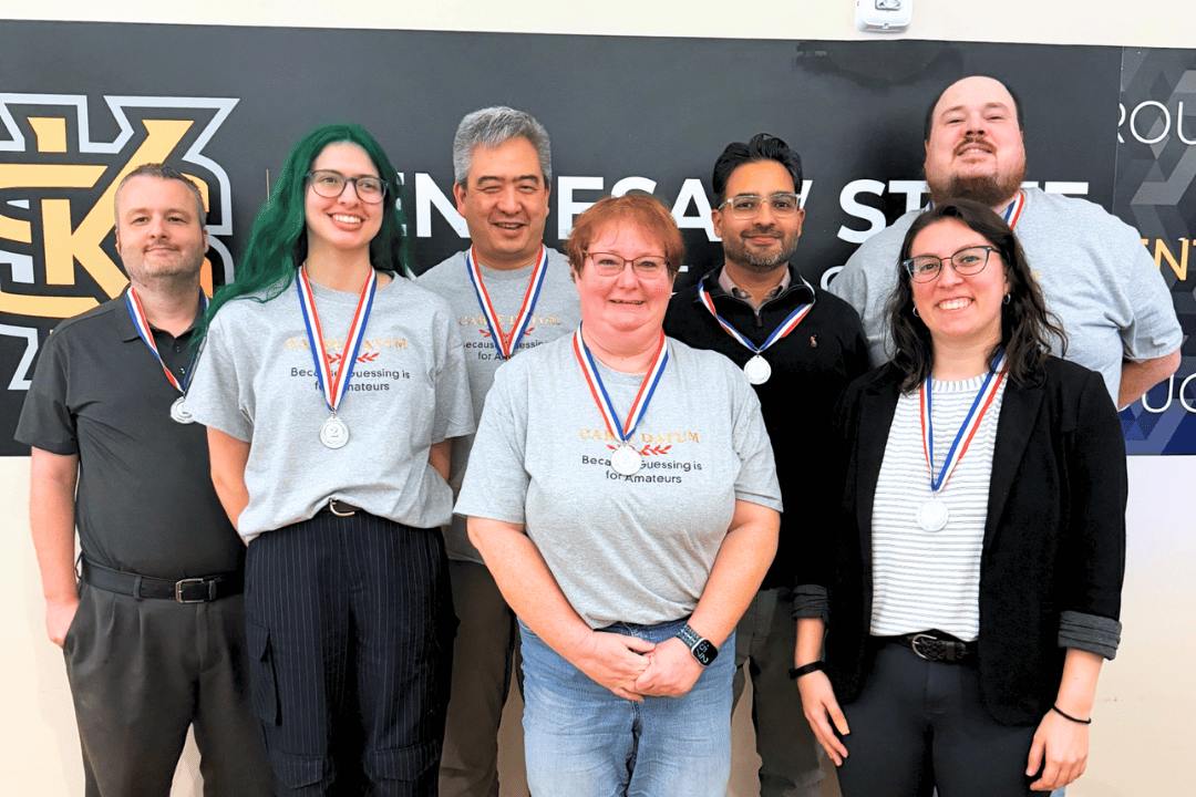 2nd placee marietta trivia winners wearing silver medals and smiling for the camera