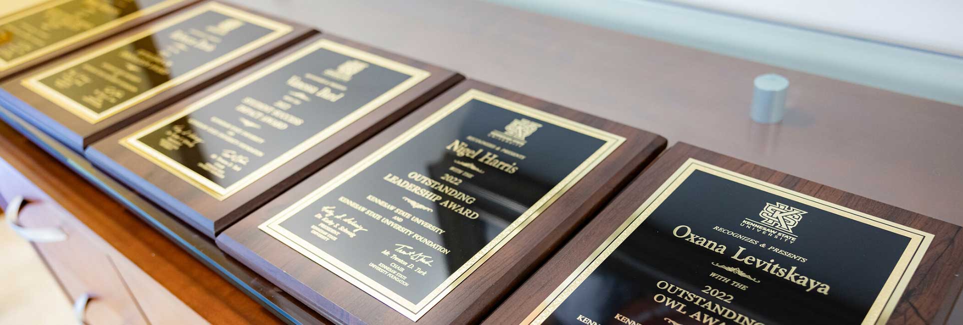 staff award plaques on table