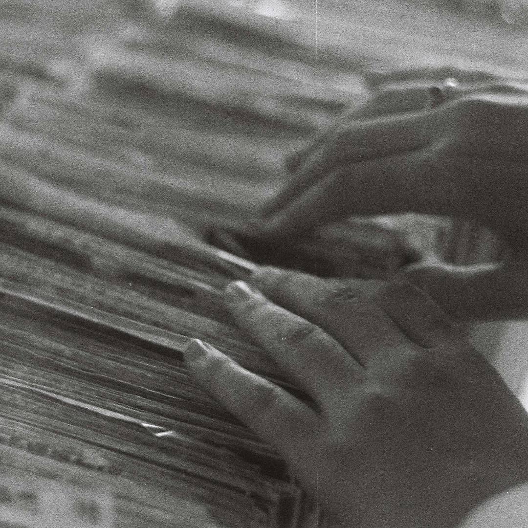 close up on hand looking through index files