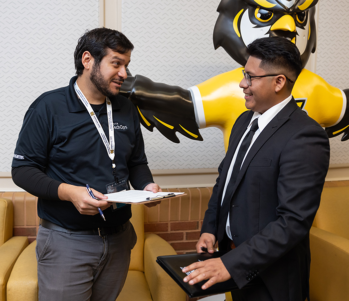 a delta recruiter talking with a student 