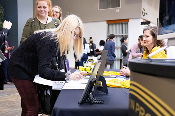 students registering at job fair