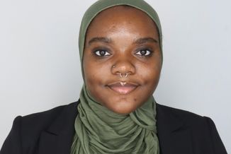 Jillianne Larkin poses for headshot.