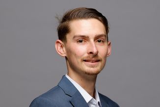 DJ Rieker poses in his intern headshot.