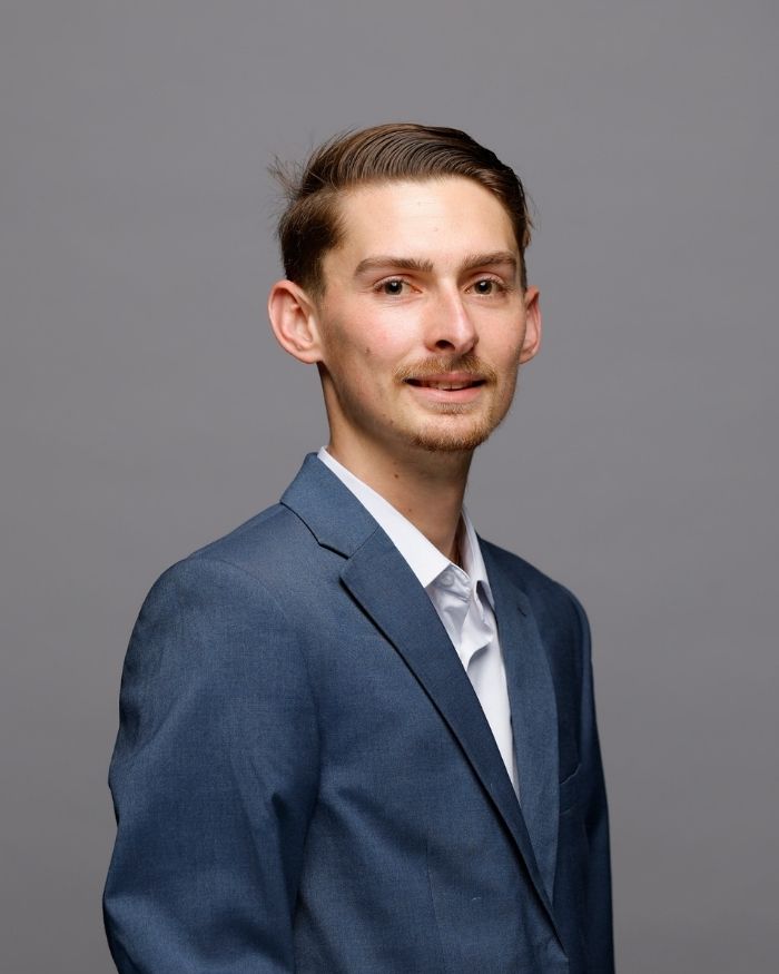 DJ Rieker poses in his intern headshot.