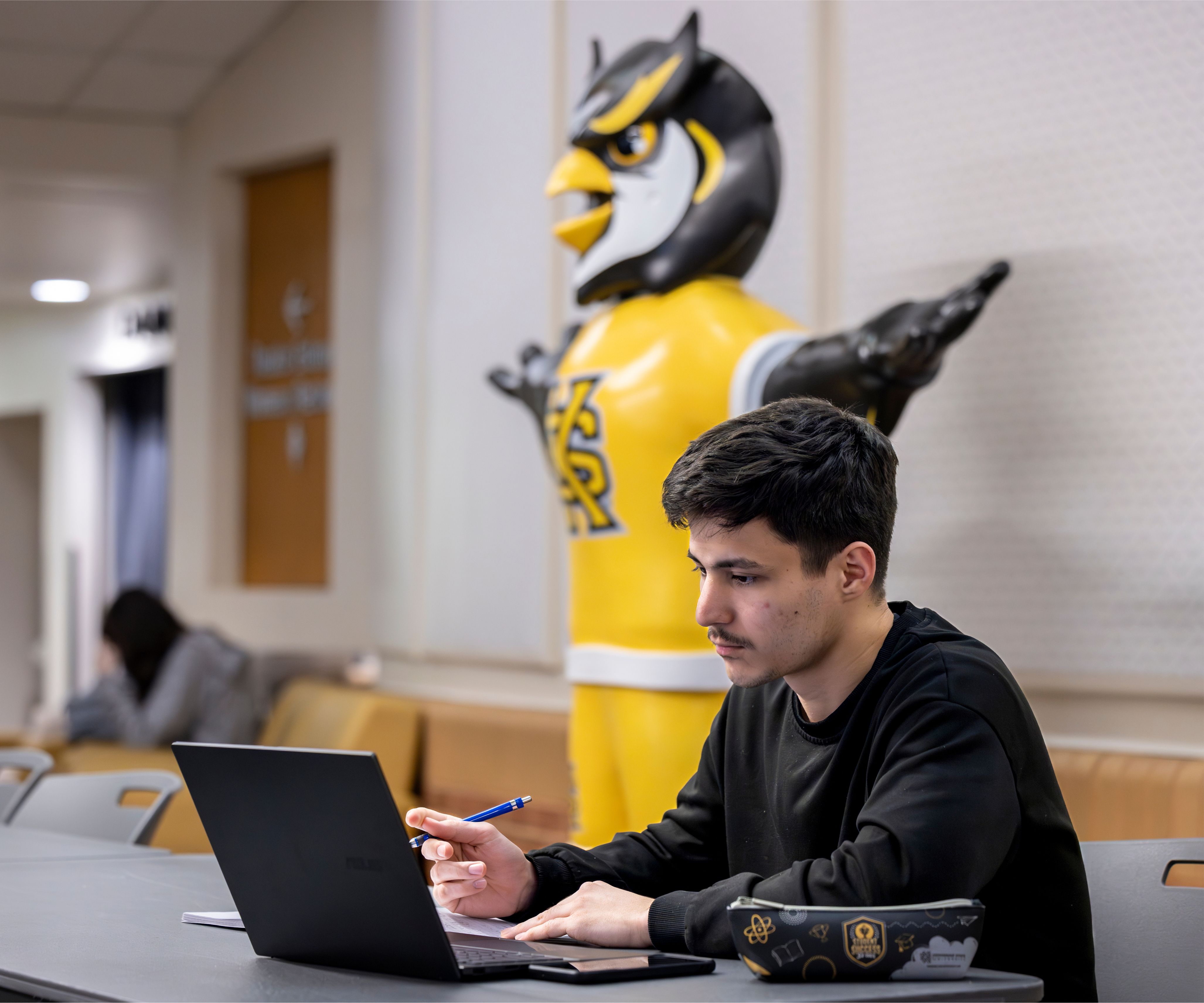 Student sitting at computer.