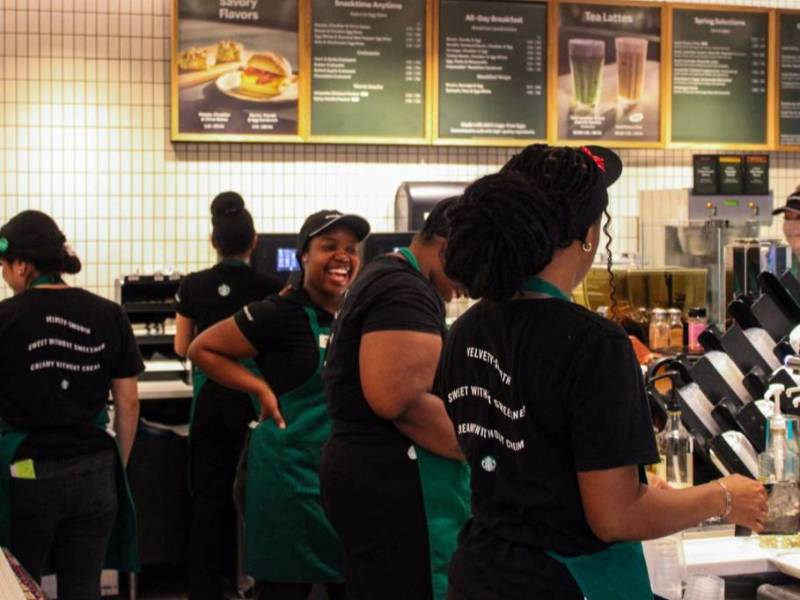 smiling employees at Starbucks