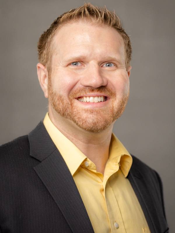 professional headshot of Shane Collins