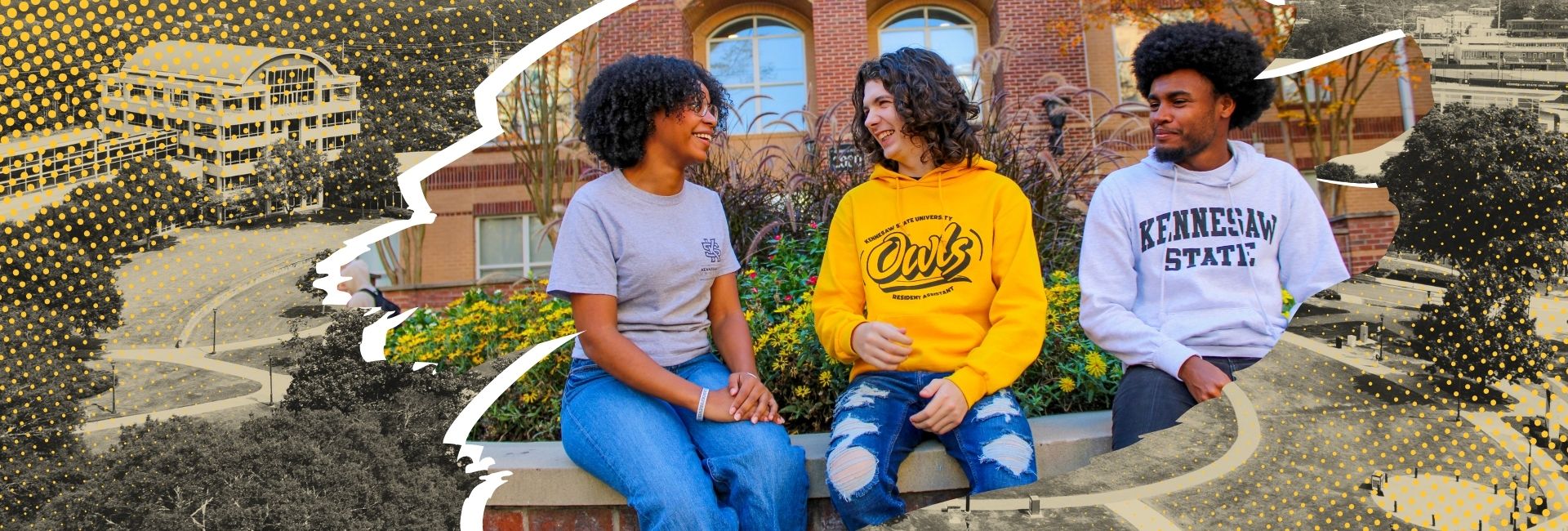 three students sitting on a wall 