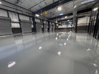 hornet hub interior warehouse with garage bay doors and work stations