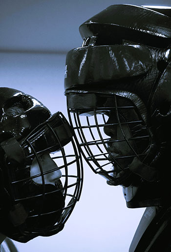 woman and man in gear butting heads