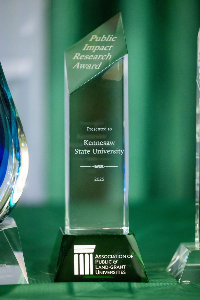 trophy against green backdrop