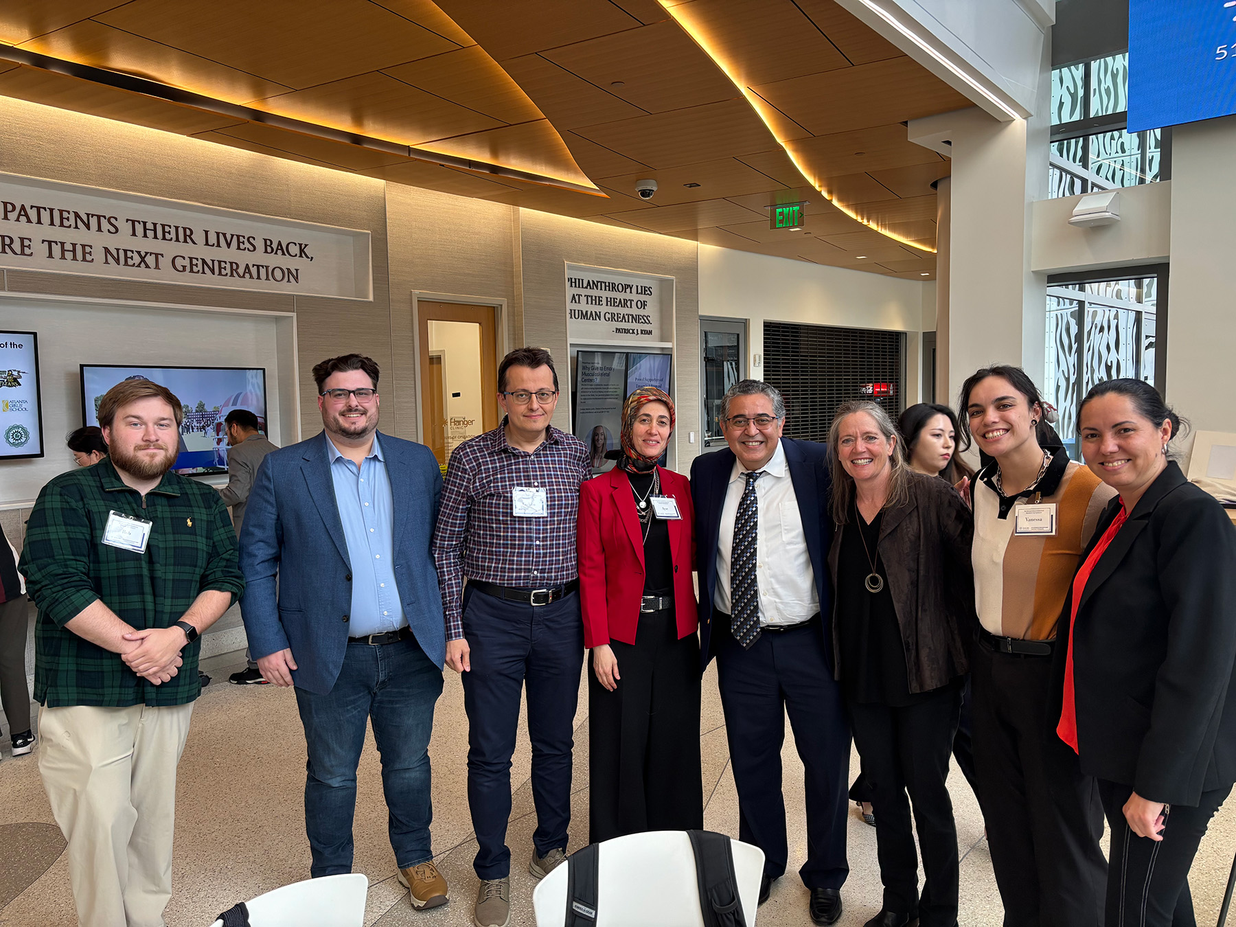 group of people representing move center posing for a picture at emory's msk symposium