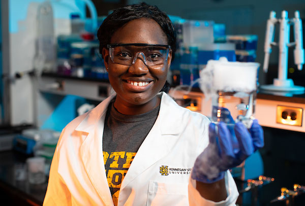 Student holding a science beaker