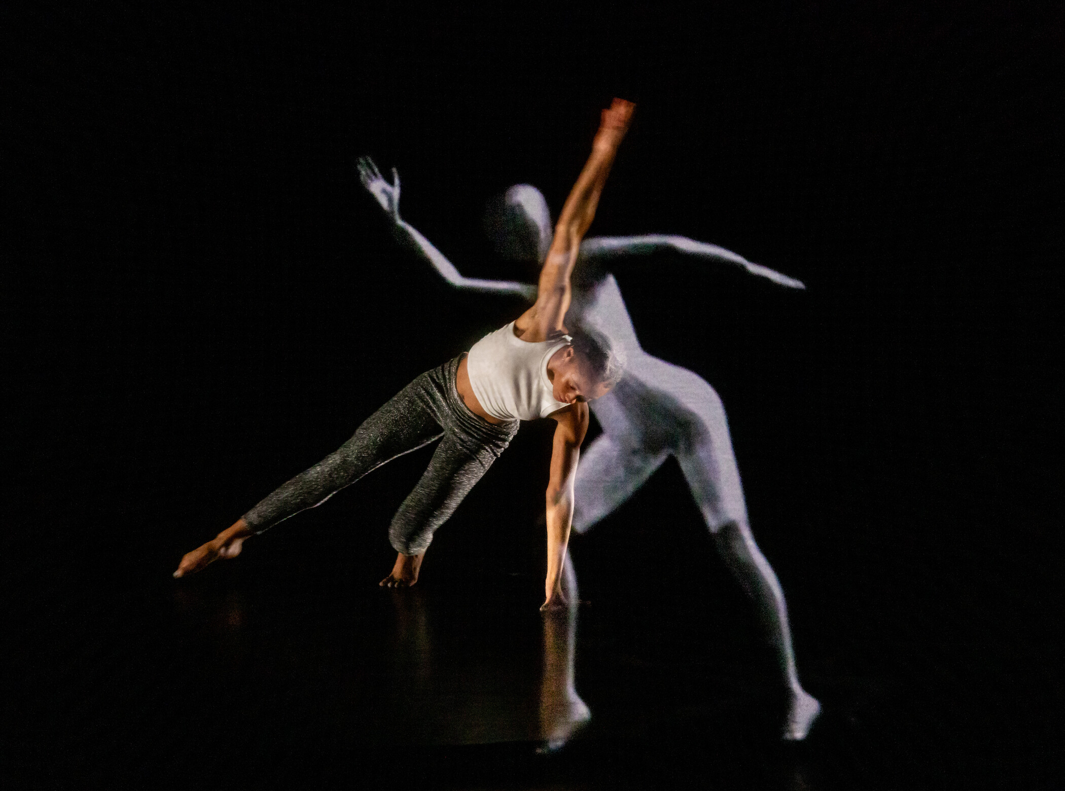 dancer performing with artificial intelligence projection.